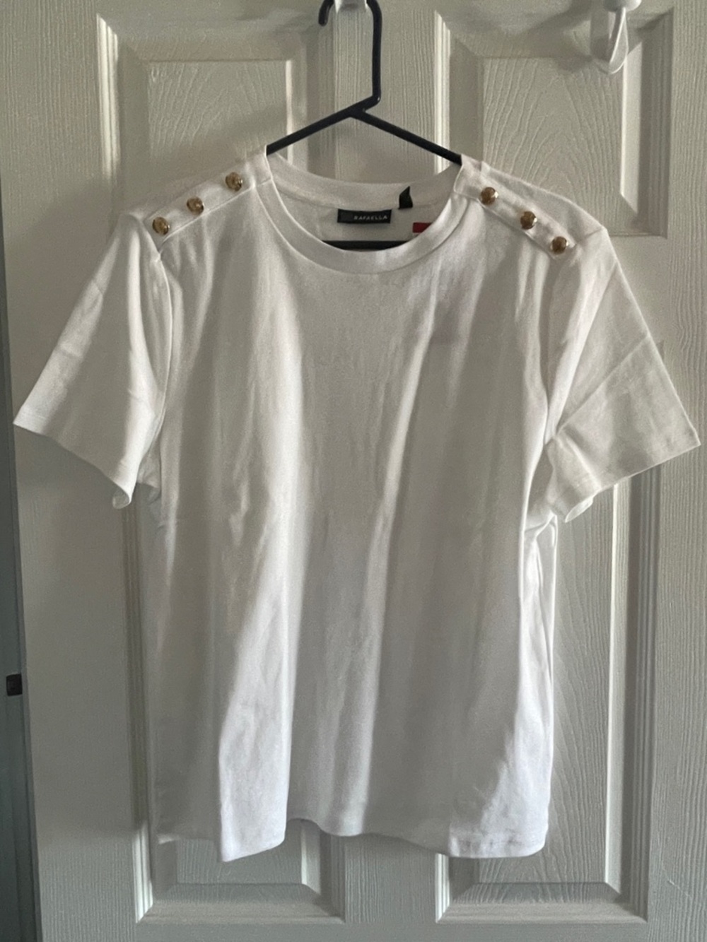 Women’s white top w gold button detail on shoulders